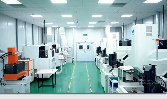 CNC and EDM machining bay on green epoxy flooring